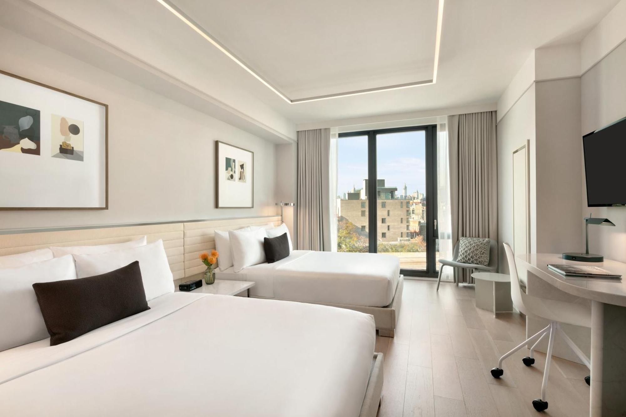 Quarto Duplo Premium com 2 Camas de Casal.