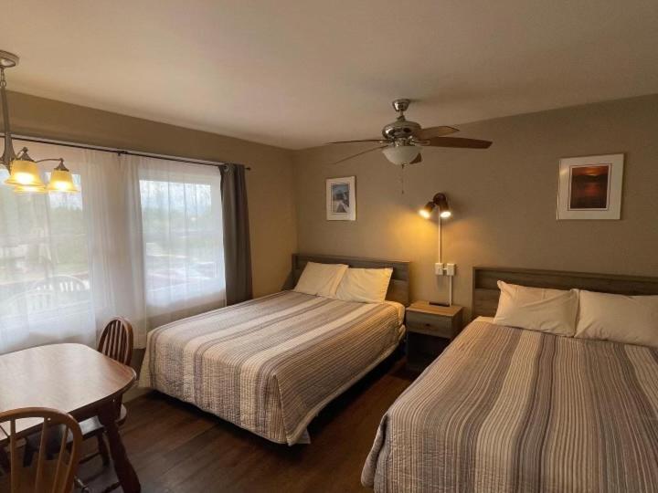 Room with Two Double Beds and Mountain View,1547078866:JPEG