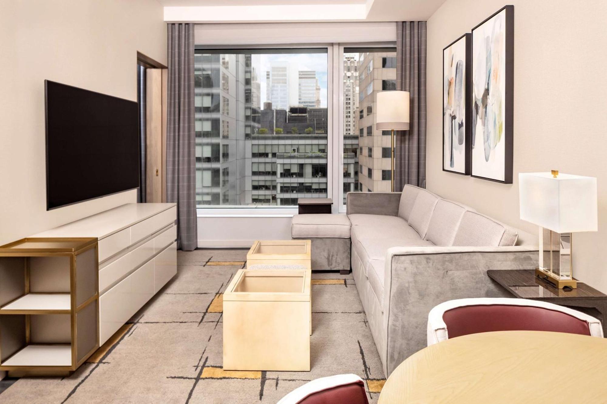 Suite Premier de 1 dormitorio con cama extragrande y sofá cama
